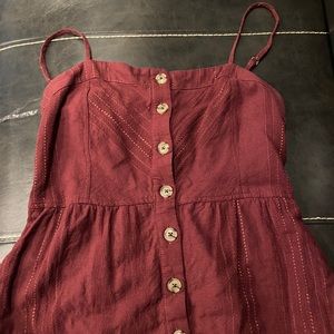 Burgundy dress with pockets.